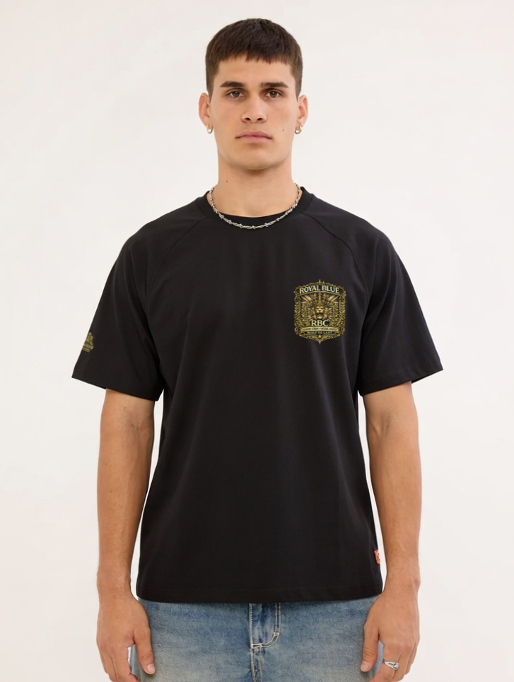 Man wearing a black t-shirt with a logo on a white background